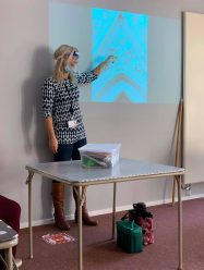 Dr Helen Bates presenting at an outreach programme